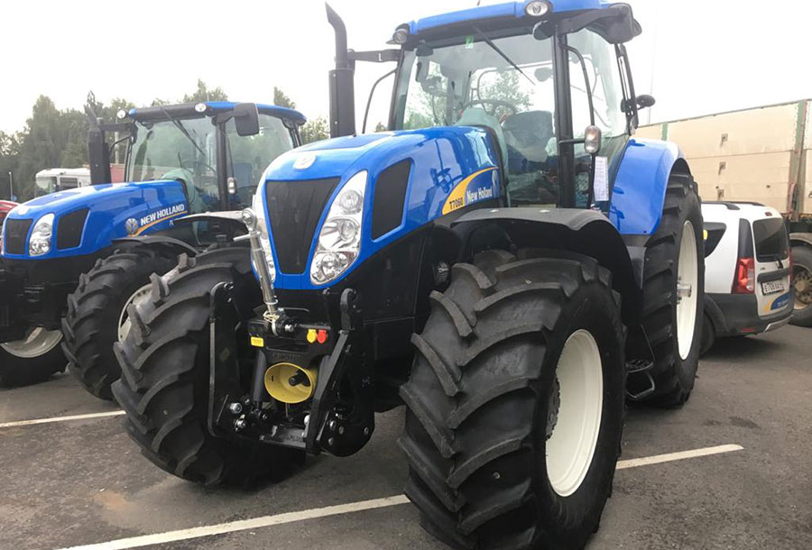 ТРАКТОР NEW HOLLAND Т7060 С УСТРОЙСТВОМ ДЛЯ НАВЕСНЫХ ОРУДИЙ STEPMLINGER НА ОСОБЫХ УСЛОВИЯХ